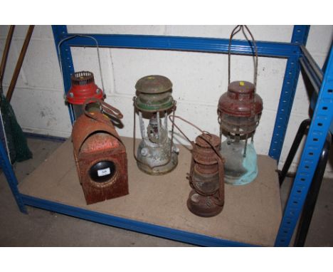Three Tilley lamps; a Hurricane lamp and a road lamp