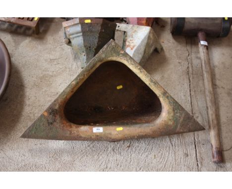 An old iron corner feed trough