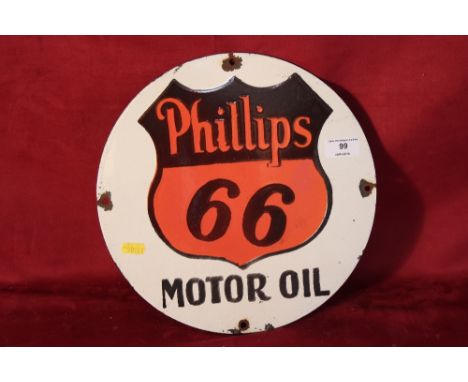 A circular enamel "Phillips 66 Motor Oil" sign, 12" dia.