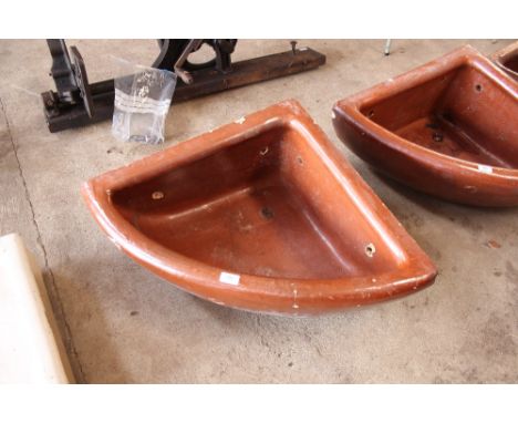 An Oats & Green of Halifax glazed stoneware corner horse trough