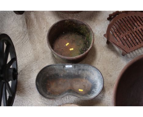 A small cast iron trough and a planter