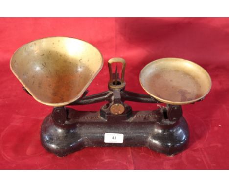 A set of Libra Scale Co. cast iron and brass kitchen scales 