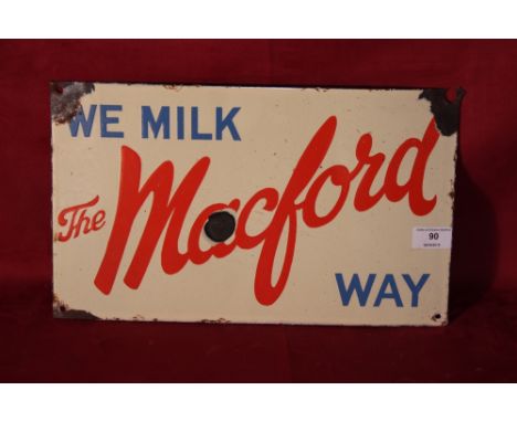 A vintage enamel sign "We Milk The Mackford Way", 9" x 15"