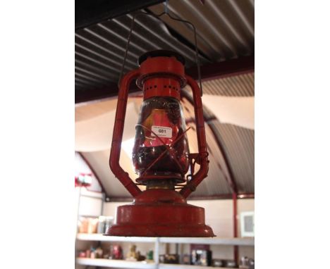 An old Hurricane lamp, painted "E S Police"