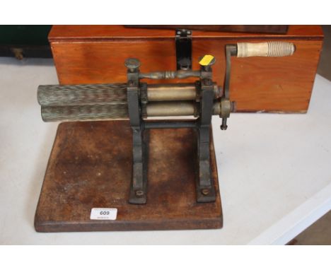 A 19th Century rotary crimping iron, with turned bone handle