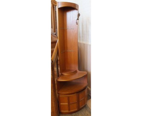 A Nathan style corner shelf unit with cupboard base