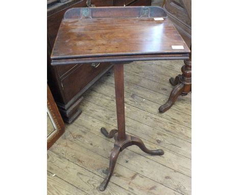 A 19th Century mahogany lift top music stand on tripod base