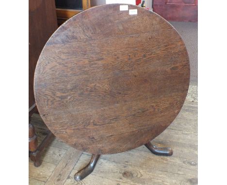 A 19th Century oak tripod flip top table
