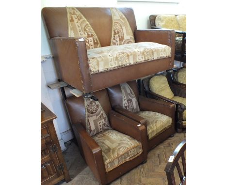 A vintage stylish brown leatherette three piece suite comprising a two seat sofa and two armchairs