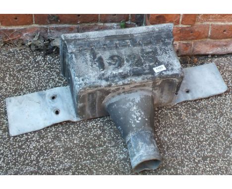 A lead drain hopper marked 1923