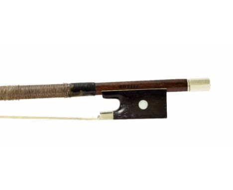 French nickel mounted violin bow stamped Pillot, the stick round, the ebony frog inlaid with pearl eyes and with a nickel ove