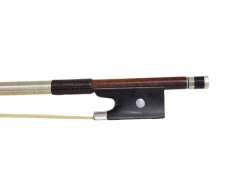 Silver mounted violin bow, unstamped, the stick round, the ebony frog inlaid with pearl eyes and the ebony adjuster with two 