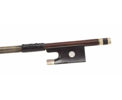 French silver mounted violin bow by and stamped Francois Lotte, the stick round, the ebony frog inlaid with pearl eyes and th