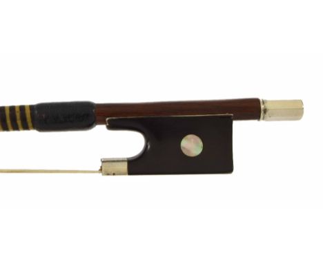 English silver mounted violin bow, unstamped, the stick octagonal, the ebony frog inlaid with pearl eyes and with a silver ov