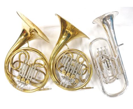 Double French brass horn with four rotary valves and a single French horn with three rotary valves; also a Boosey &amp; Hawke