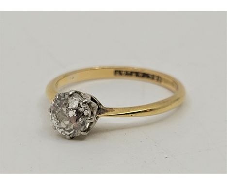 An 18ct. yellow gold and platinum diamond solitaire ring, set old-cut diamond (EDW 0.75 carats), size UK O. (gross weight 2.5