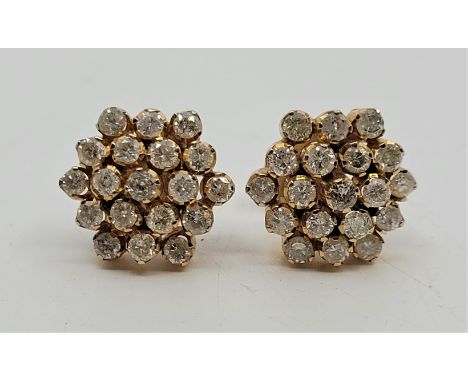 A pair of precious yellow metal diamond cluster earrings, each having domed mount set nineteen round brilliant cut diamonds, 