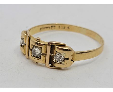 A 18ct. yellow gold three stone diamond ring, set three graduated old-cut diamonds (ETDW 0.25 carats), size UK X 1/2. (gross 