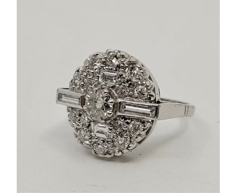 An 18ct white gold diamond cluster ring, having oval domed mount set round brilliant cut diamond to centre (EDW 0.40 carats) 