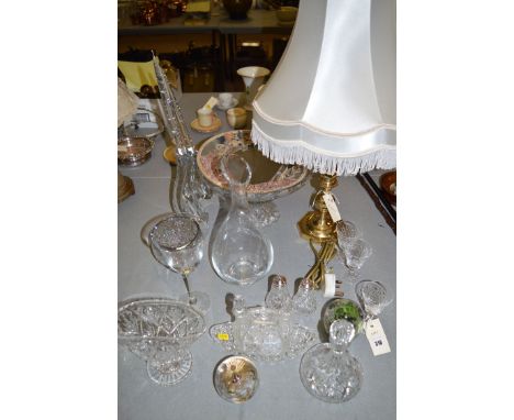 A brass table lamp; a modern florally decorated perfume glass; a Caithness paperweight; and one other; a pair of crystal cand