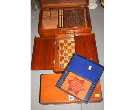 A mahogany games box, comprising: a solitaire board and a cribbage board with space for cards, counters; etc; together with t