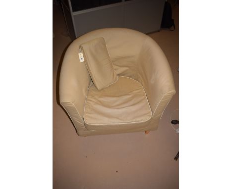 A modern tub type armchair with loose seat cushion.