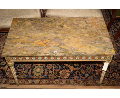 A modern rectangular marble top coffee table on cream painted base, decorative frieze, with metal and ceramic mounts.