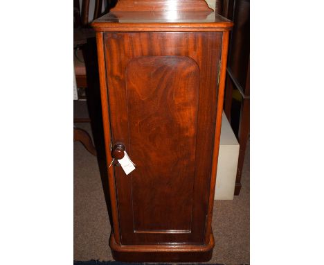 A Victorian mahogany tall slender pot cupboard with rounded corners, fitted a single arched panelled door enclosing a shelf.