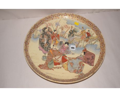 An Asian Satsuma ceramic plaque with figure decoration, with gilt and floral border.
