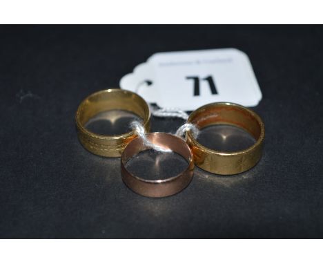 An 18ct. gold wedding band with star cut design; together with another, 11grms gross; and a 9ct. rose gold ring, 1.9grms.