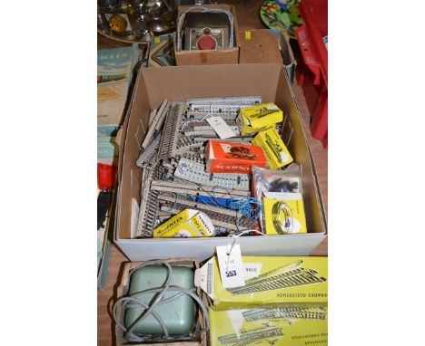 A box of Marklin track, including Nos. 5106, 5121, boxed and unopened; control units; etc.