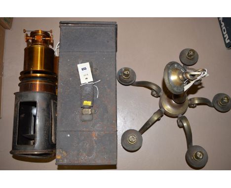 A late 19th Century brass and metal magic lantern converted to electricity, in metal case; together with a five-branch brass 