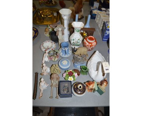 A quantity of decorative ceramics; a pair of Wedgwood Jasperware vases; a table lighter; a jug; a jar and cover; three baller