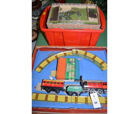 A Chad Valley clockwork train set, in original box; together with a Britains miniature garden and doll's house furniture.
