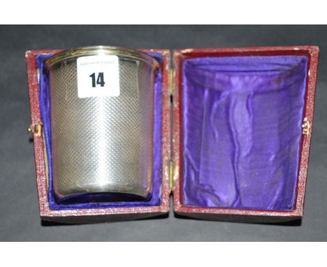 A 19th Century copper plated beaker, with gilt interior and engine turned design, in leather covered exterior case.