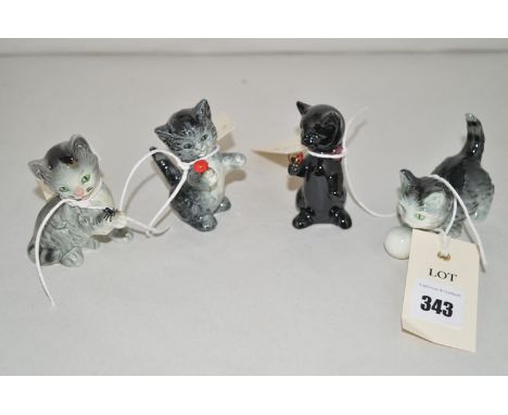 Four Goebel kitten ornaments.