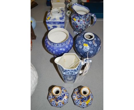A Shelley blue and white shouldered vase in 'Cloisello' pattern; a Maling Chintz jug; a Maling tea caddy; a blue and white Ty