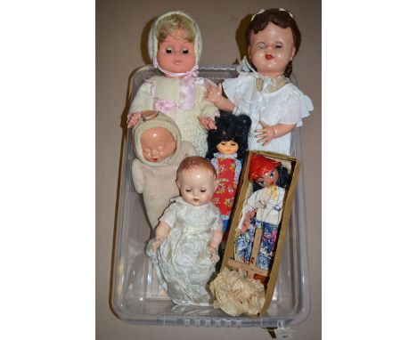 A boxed Pelham puppet, Type LS Mexican Girl; and four mid 20th Century dolls.
