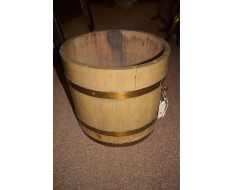 Lister & Co: a coopered jardiniere bucket, the brass bindings with copper studs, fitted brass ring handles.
