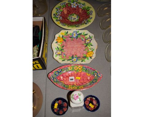 Two Maling ceramic bowls and a plate; a pair of small Moorcroft coasters; and an antique ceramic bottle with hand-painted dec