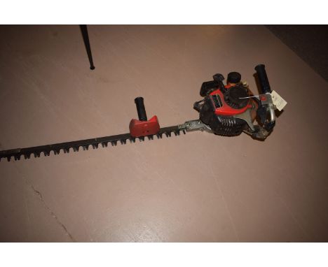 A petrol driven hedge trimmer, model no. TF22 with Kawasaki engine.