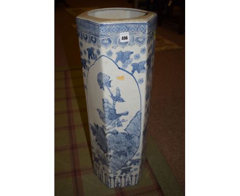 A Chinese octagonal blue and white ceramic stick stand, with bird and floral decoration.