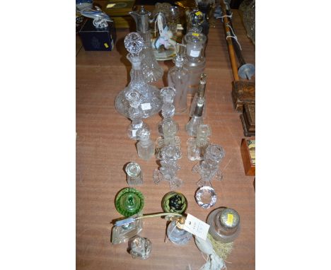 A silver plated mounded glass claret jug; a ship's decanter and stopper; three pairs of glass candlesticks; two scent sprays;