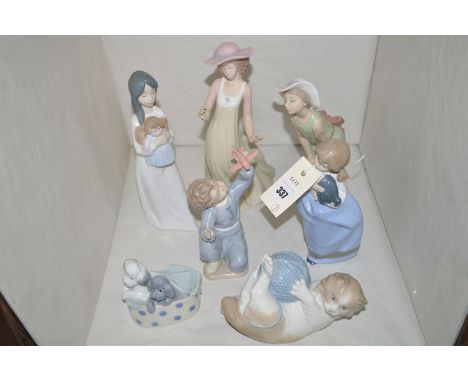 A Lladro figure of a young girl wearing a bonnet; together with four Nao figurines; a kitten playing with a ball of wool; and