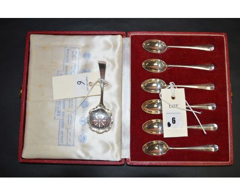 A set of six silver coffee spoons for the British Silver Hallmarks, in fitted case; together with a silver sugar sifting spoo