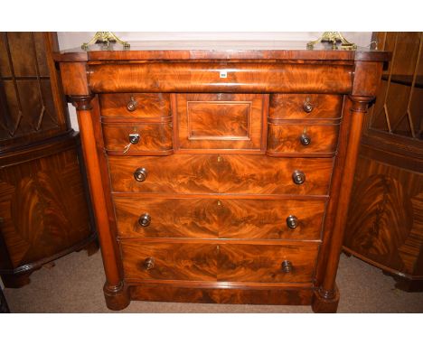 A Victorian mahogany scotch chest of drawers, the shaped frieze drawer above an arrangement of two deep and two shallow drawe