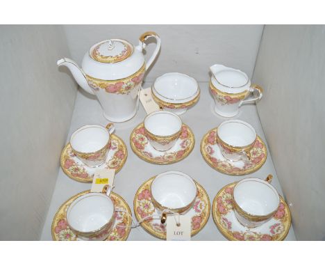 An Aynsley coffee service with floral band decoration, comprising: coffee pot, sugar and cream jug, together with six cups an