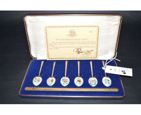 A set of six silver gilt coffee spoons with enamel bowl backs, for the Birmingham Mint, limited edition of 2000, decorated wi