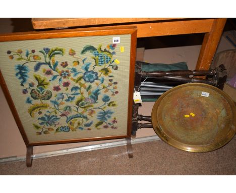 A needlework firescreen; a brass tray on folding stand.