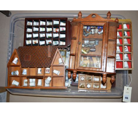 A large collection of thimbles: ceramic, cloisonne, silver plated, to include: thimble display stands.